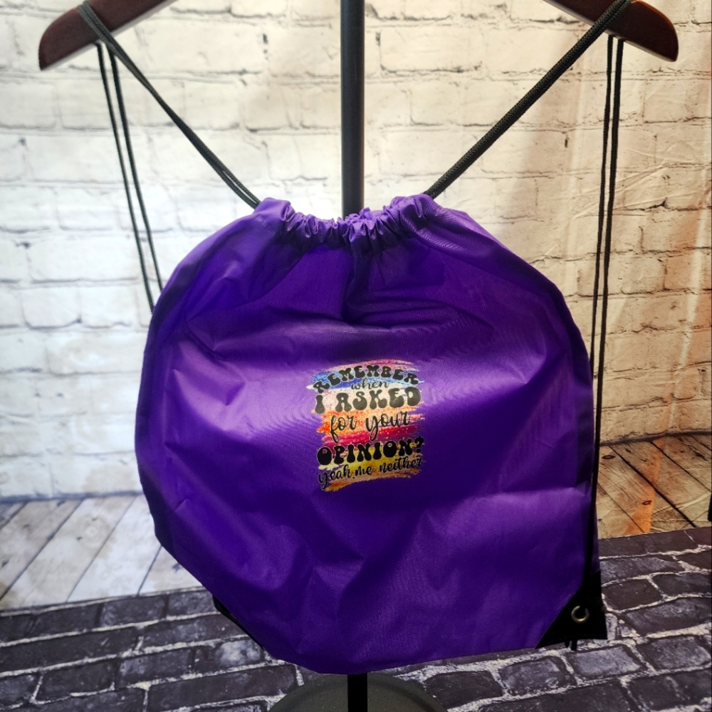 NEW Swag bag with a multi colored graphic design placed on a purple material
